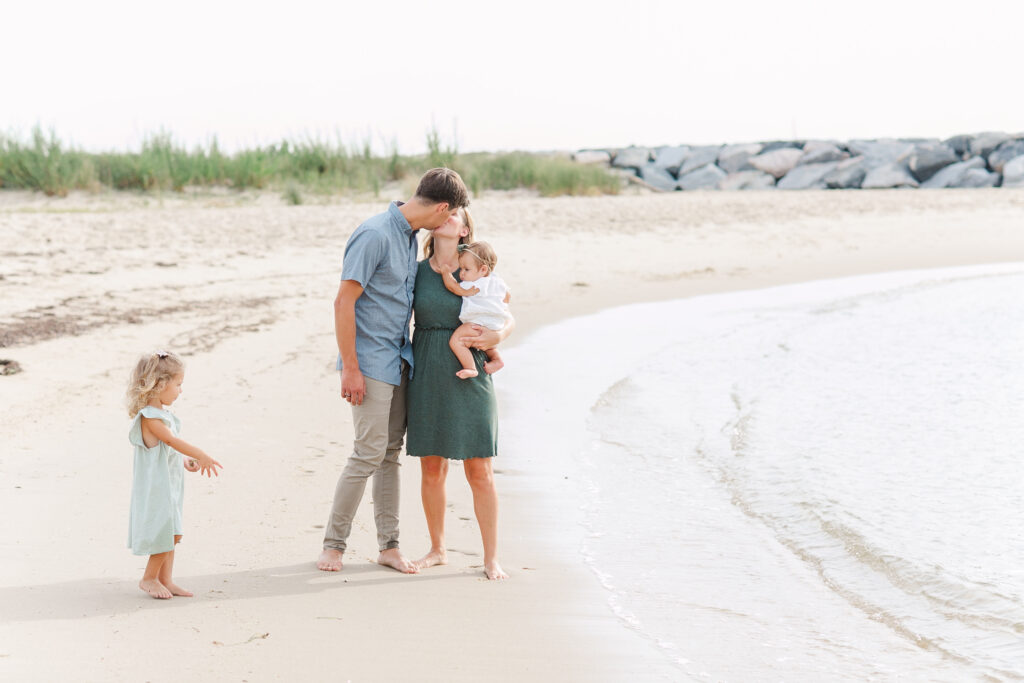 classic casual family beach photo, kissing and walking on the beach